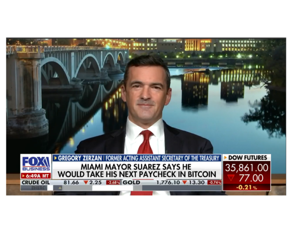 man on news talking about crypto